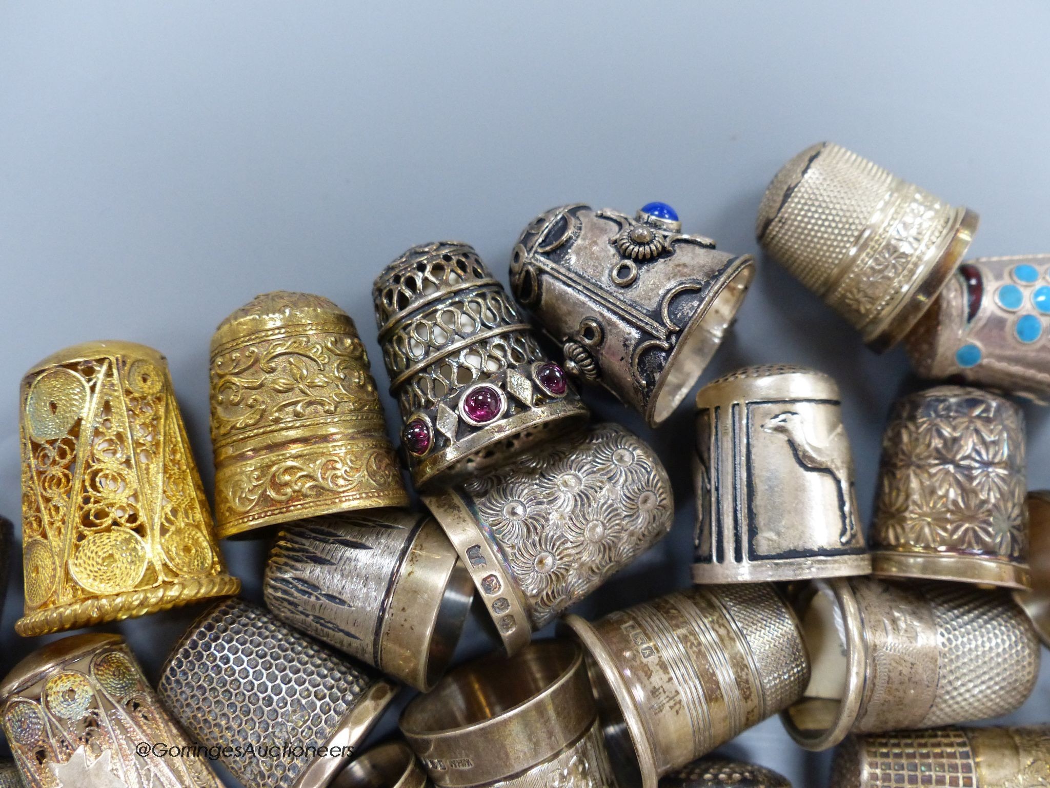 A collection of silver thimbles including a silver Charles Horner thimble